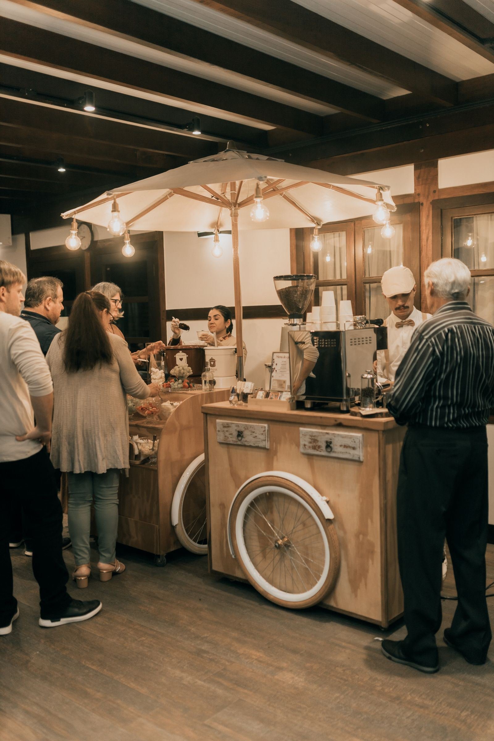 Guests gathered around an indoor mobile coffee bar